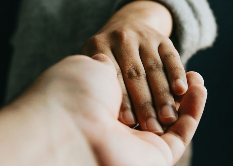 Close up of two hands holding